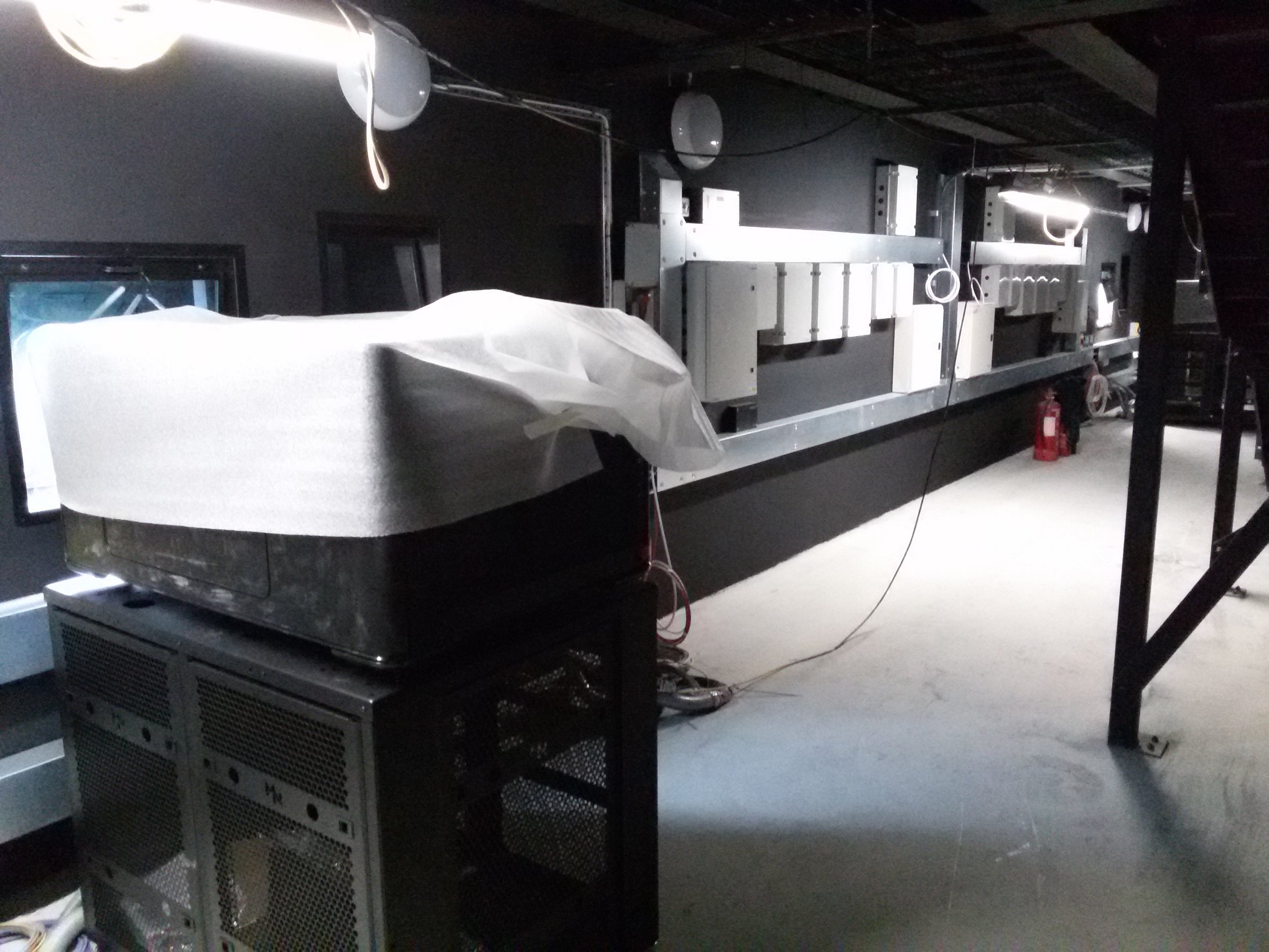 A commercial fit-out in progress with trunking and electrical gear along the wall